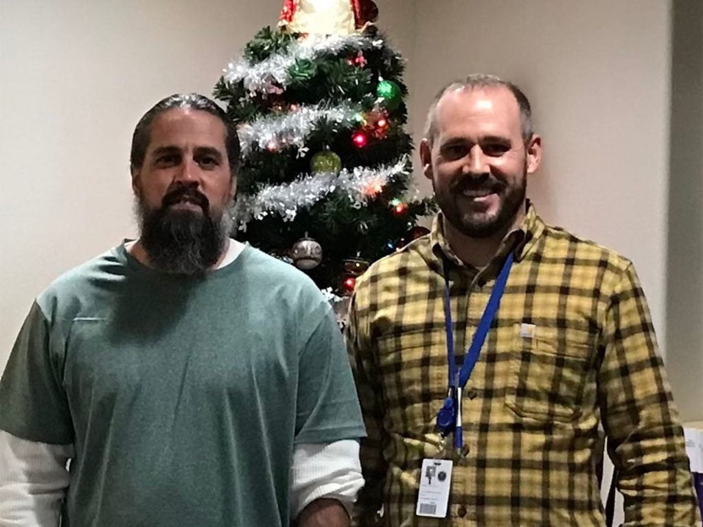Chaplain with inmate at Christmas