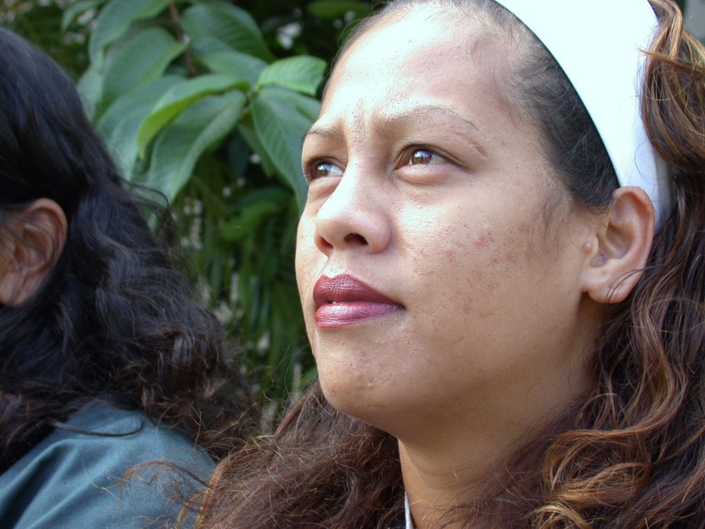 Hopeful woman in prison hearing about the Gospel